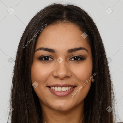 Joyful latino young-adult female with long  brown hair and brown eyes