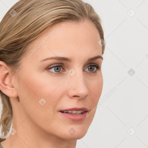 Joyful white young-adult female with medium  brown hair and blue eyes