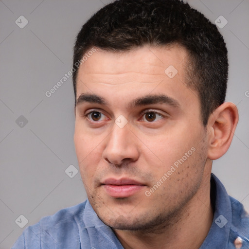 Neutral white young-adult male with short  black hair and brown eyes