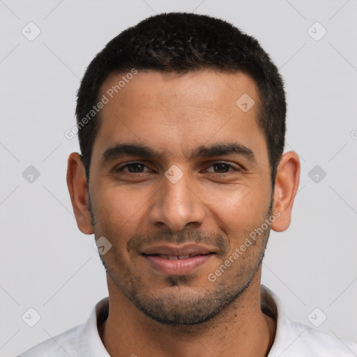 Joyful latino young-adult male with short  black hair and brown eyes