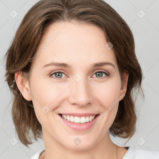 Joyful white young-adult female with medium  brown hair and blue eyes