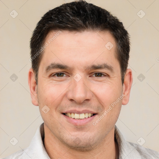 Joyful white adult male with short  brown hair and brown eyes