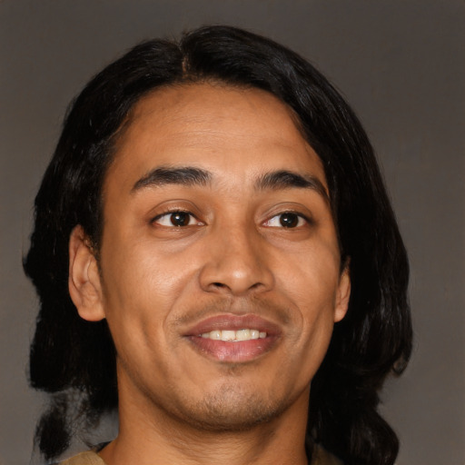 Joyful asian young-adult male with medium  black hair and brown eyes