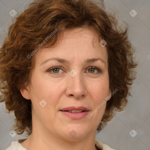 Joyful white adult female with medium  brown hair and green eyes