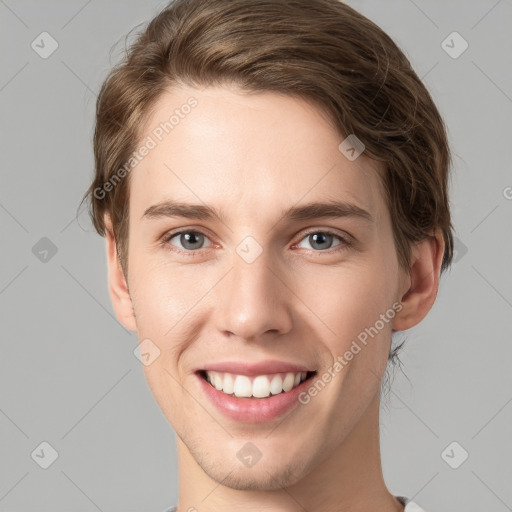 Joyful white young-adult female with short  brown hair and grey eyes