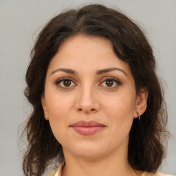 Joyful white young-adult female with medium  brown hair and brown eyes