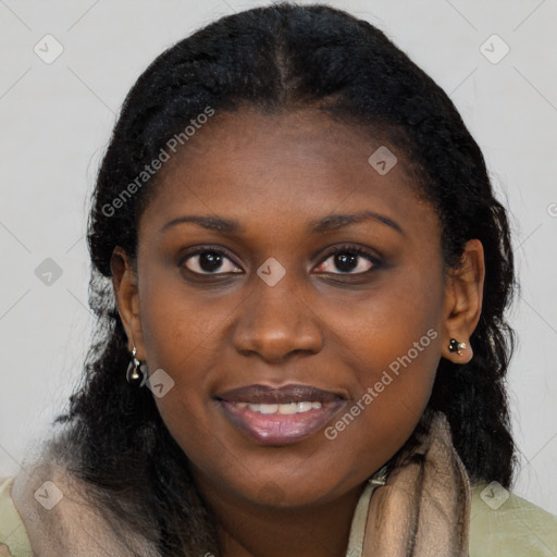 Joyful black young-adult female with long  black hair and brown eyes