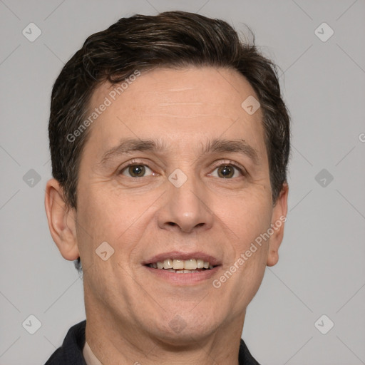 Joyful white adult male with short  brown hair and brown eyes