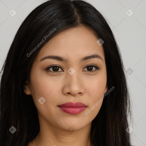 Joyful latino young-adult female with long  brown hair and brown eyes