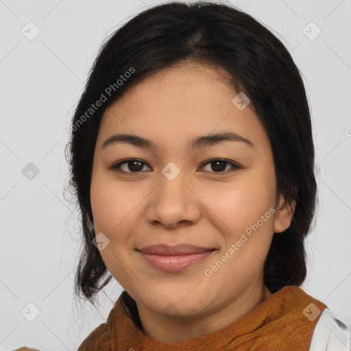 Joyful latino young-adult female with medium  brown hair and brown eyes