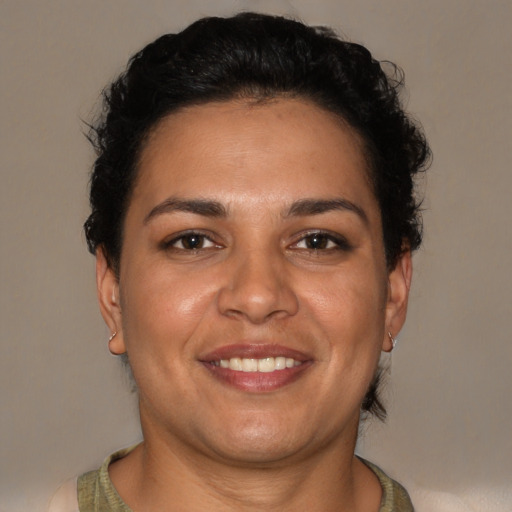 Joyful latino young-adult female with short  brown hair and brown eyes