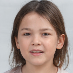 Joyful white child female with medium  brown hair and brown eyes