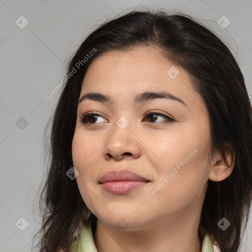 Joyful asian young-adult female with long  brown hair and brown eyes