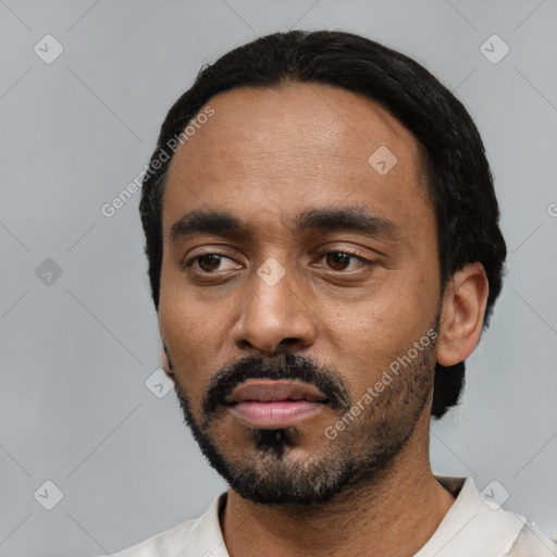 Neutral black young-adult male with short  black hair and brown eyes