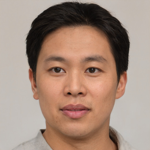 Neutral asian young-adult male with short  brown hair and brown eyes