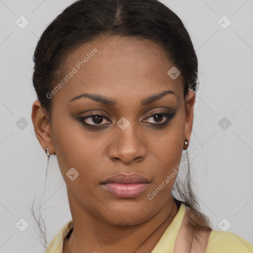 Joyful black young-adult female with short  brown hair and brown eyes