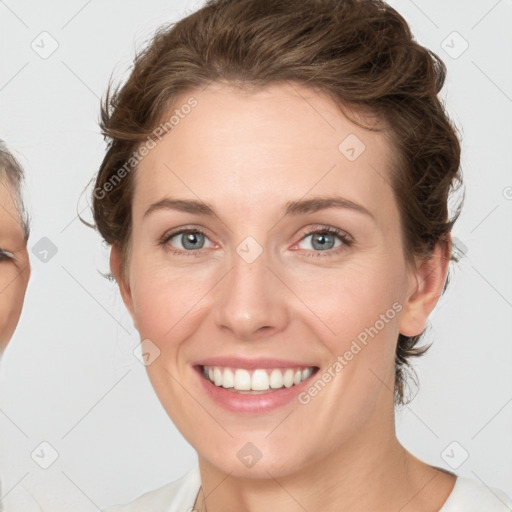 Joyful white young-adult female with medium  brown hair and green eyes