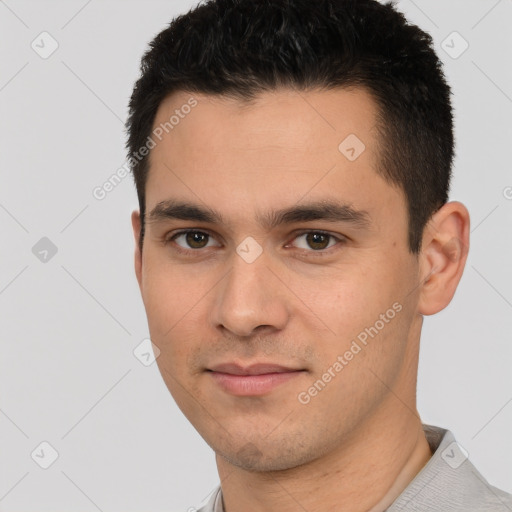 Joyful white young-adult male with short  black hair and brown eyes