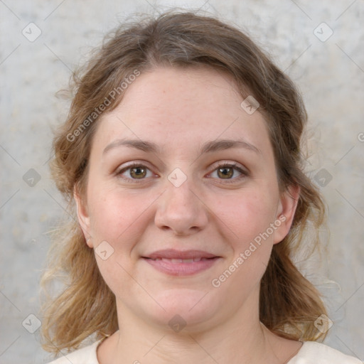 Joyful white young-adult female with medium  brown hair and green eyes