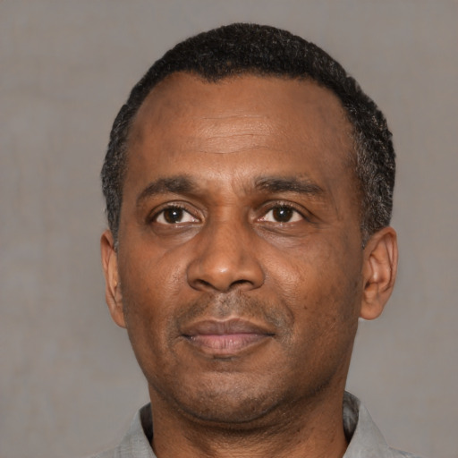 Neutral latino adult male with short  black hair and brown eyes