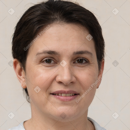 Joyful white adult female with short  brown hair and brown eyes