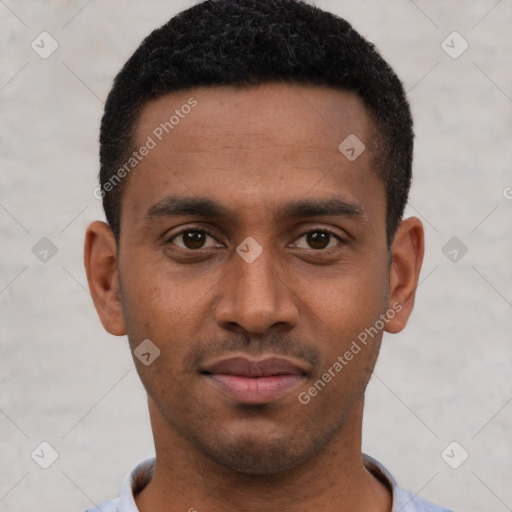 Joyful black young-adult male with short  brown hair and brown eyes