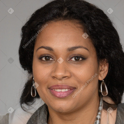 Joyful black young-adult female with long  brown hair and brown eyes