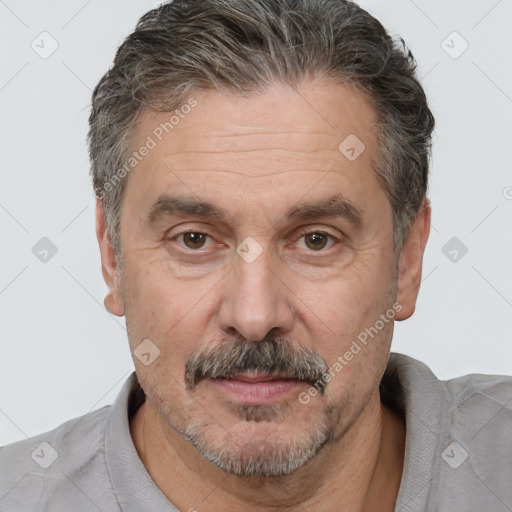 Joyful white middle-aged male with short  brown hair and brown eyes