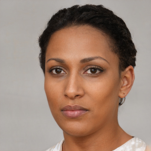 Neutral black young-adult female with short  black hair and brown eyes