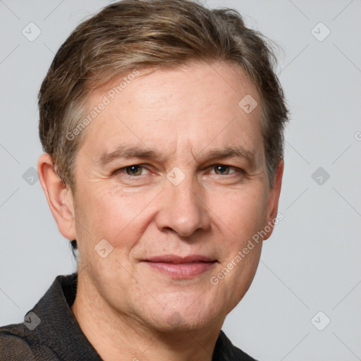 Joyful white adult male with short  brown hair and grey eyes