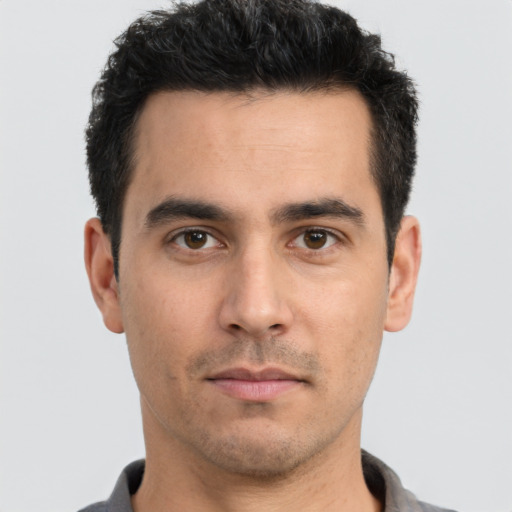 Neutral white young-adult male with short  black hair and brown eyes