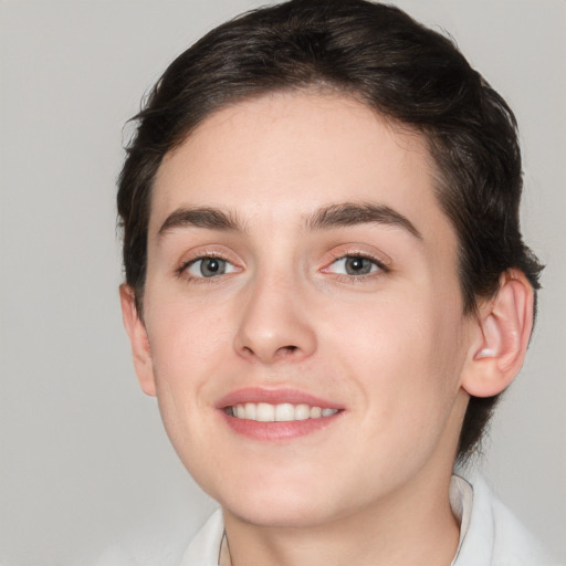 Joyful white young-adult male with medium  brown hair and brown eyes