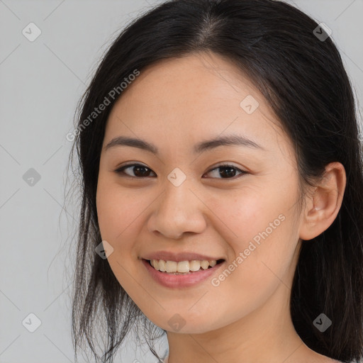 Joyful asian young-adult female with long  brown hair and brown eyes