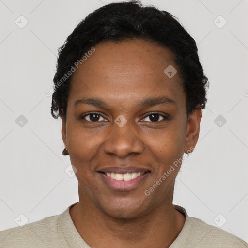 Joyful black young-adult female with short  black hair and brown eyes