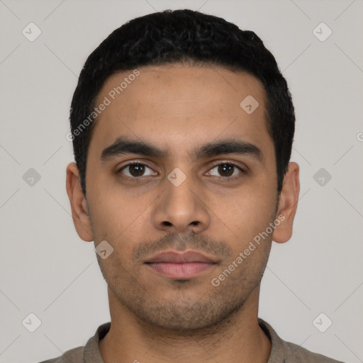 Neutral latino young-adult male with short  black hair and brown eyes