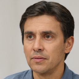 Neutral white adult male with short  brown hair and brown eyes