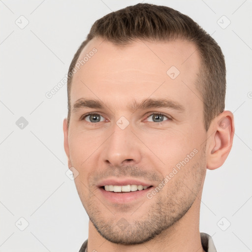 Joyful white young-adult male with short  brown hair and brown eyes