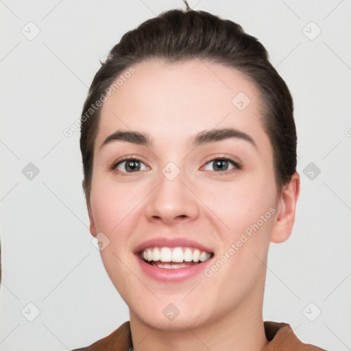 Joyful white young-adult female with short  black hair and brown eyes