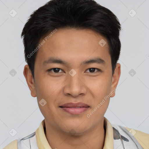 Joyful asian young-adult male with short  brown hair and brown eyes