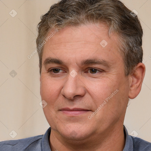 Joyful white adult male with short  brown hair and brown eyes