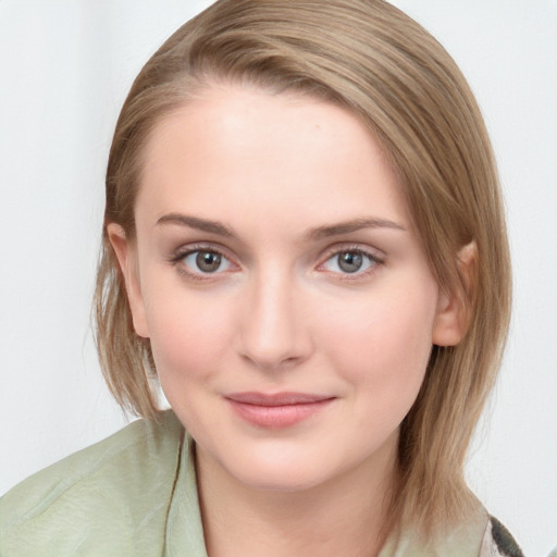 Joyful white young-adult female with medium  brown hair and blue eyes