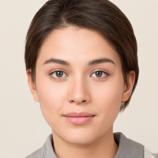 Neutral white young-adult female with short  brown hair and brown eyes