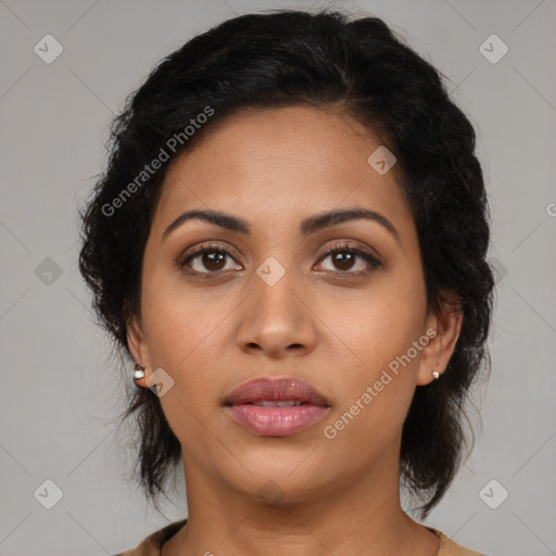 Joyful latino young-adult female with medium  brown hair and brown eyes