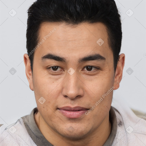 Joyful latino young-adult male with short  brown hair and brown eyes