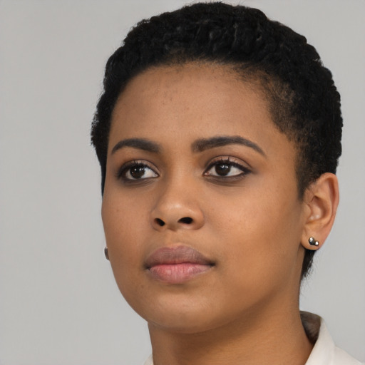 Neutral black young-adult female with short  black hair and brown eyes