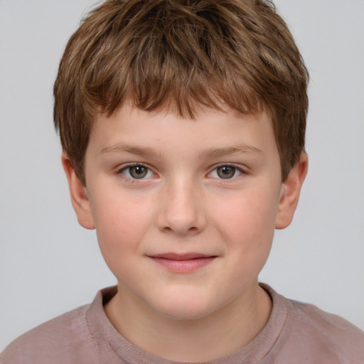 Joyful white child male with short  brown hair and grey eyes