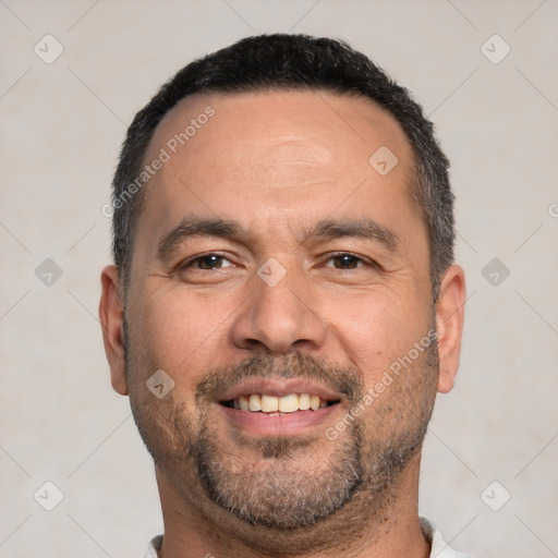 Joyful white adult male with short  black hair and brown eyes