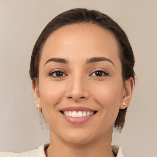 Joyful white young-adult female with medium  brown hair and brown eyes