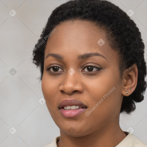 Joyful black young-adult female with short  black hair and brown eyes