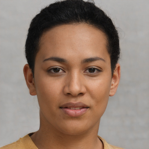 Joyful latino young-adult female with short  brown hair and brown eyes